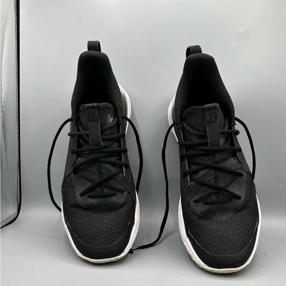 Under Armour Men's Curry 7 Team sneakers in black and white.